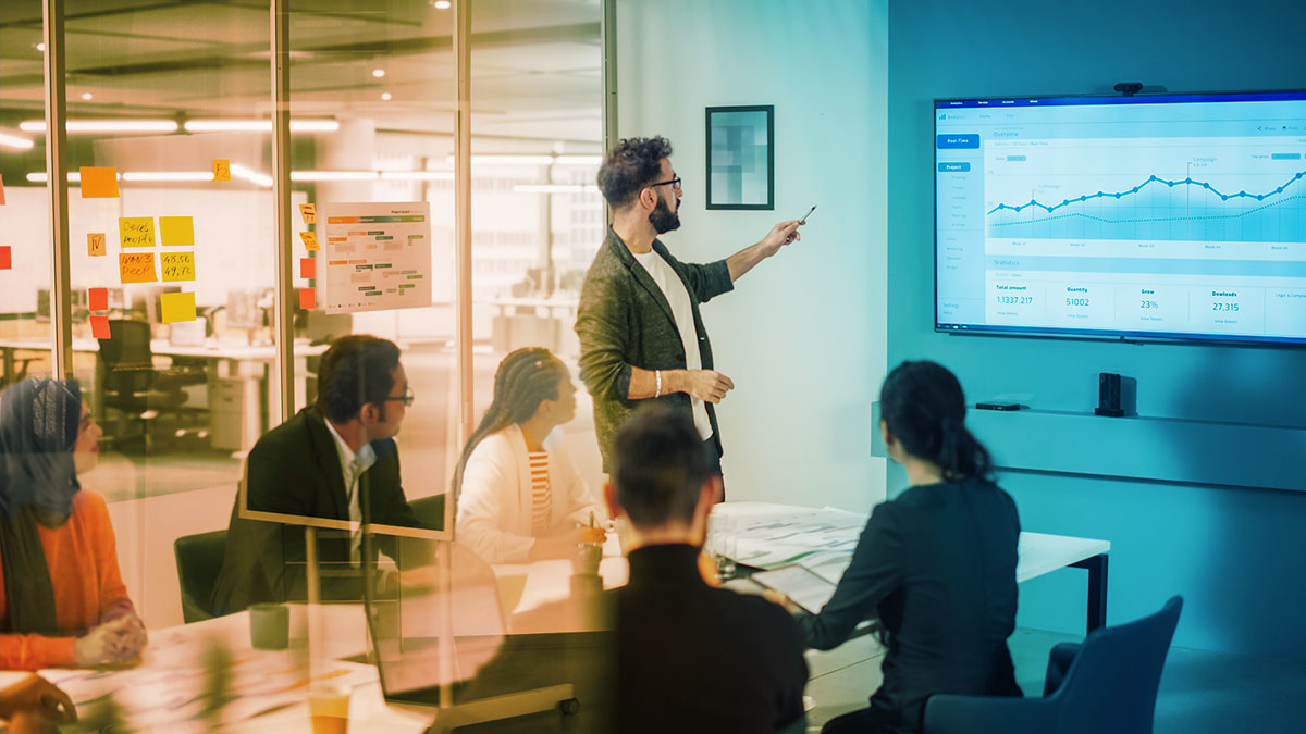 corporate meeting reviewing cx data metrics